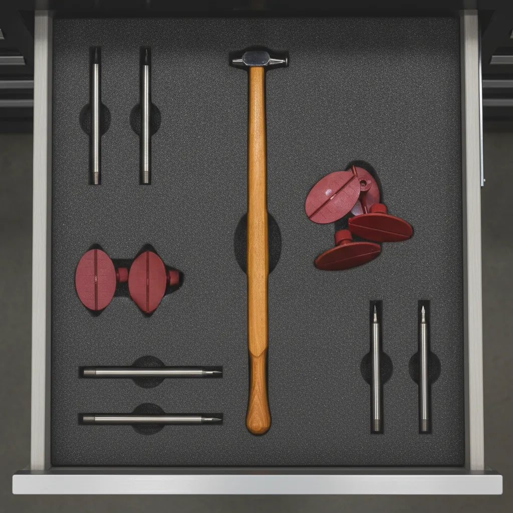 Organized workshop drawer with PDR hammers, glue tabs, and hand tools